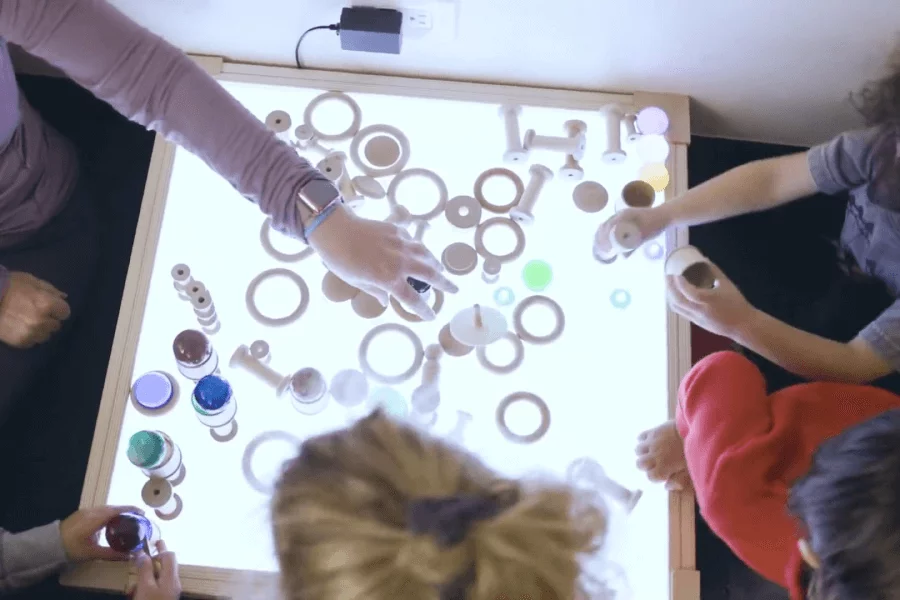 kids playing on light up table